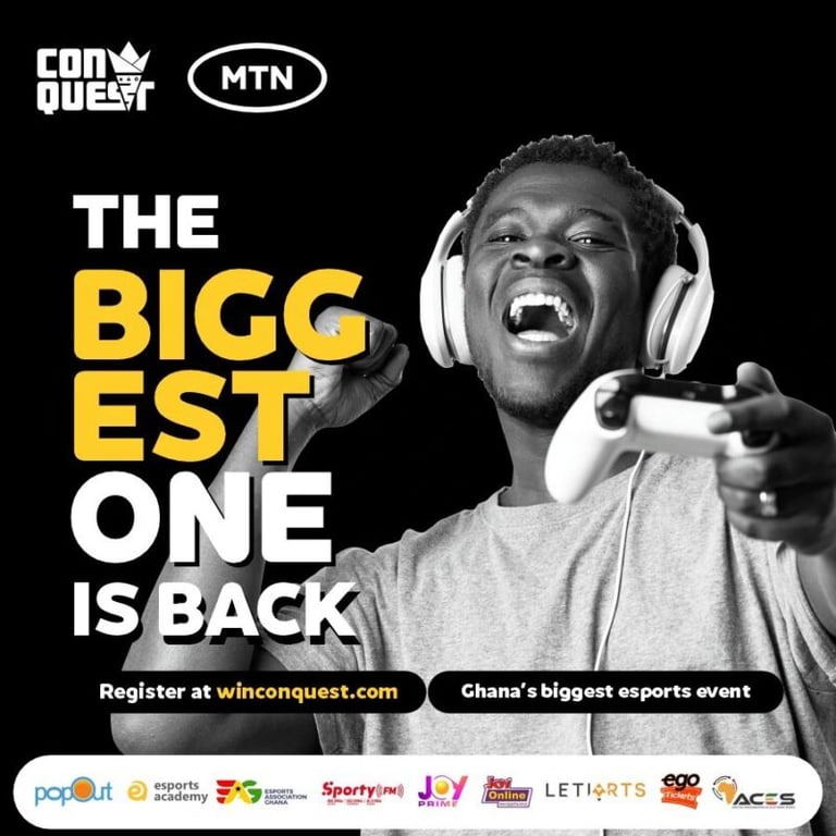 A man wearing headphones is holding a game controller.