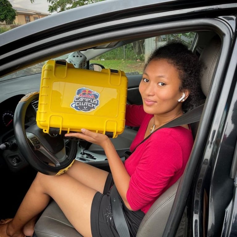 A woman in a red shirt holds a yellow box with the words "Campus Clutch" on it.